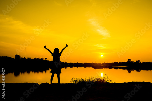 Girl in sunset  Gold light from sunset  Freedom and happiness girl in nature