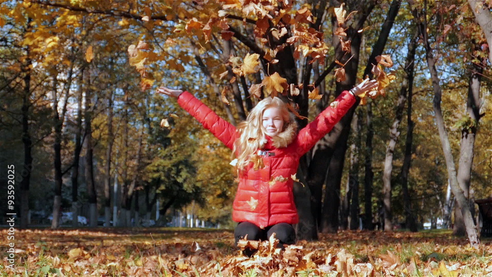 Girl throwing leaves in Autumn in slow motion Girl throwing leaves in Autumn in slow motion