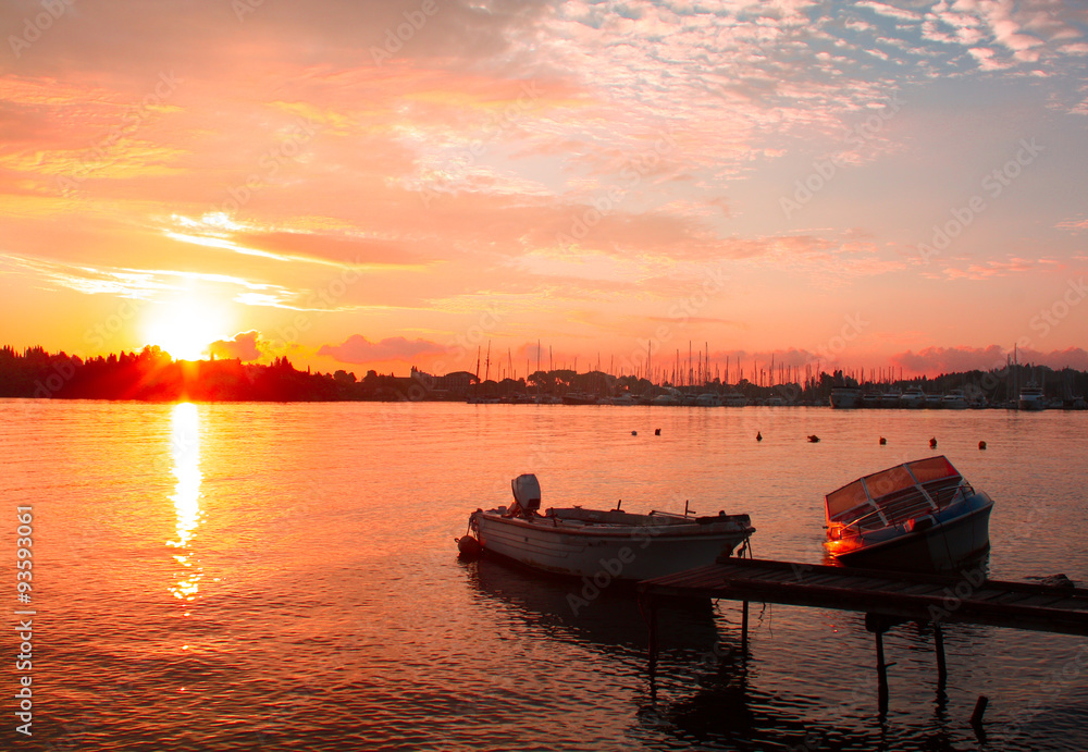 dramatic sunset color with boats dramatic sunset color with boats