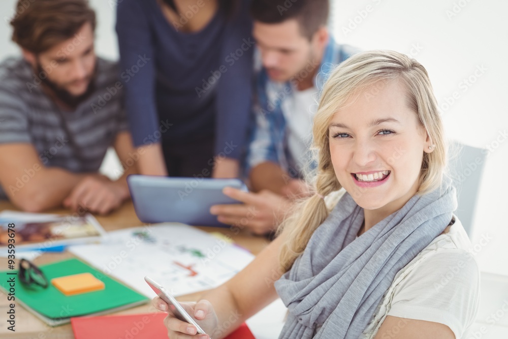 Obraz premium Portrait of cheerful woman using smartphone 