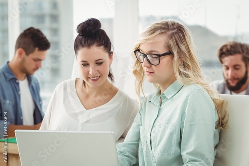 Businesswomen working on laptop 