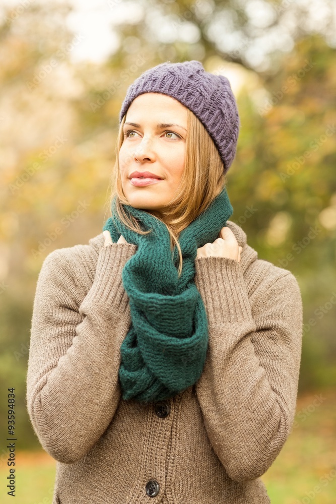 Smiling pretty woman holding her scarf Smiling pretty woman holding her scarf