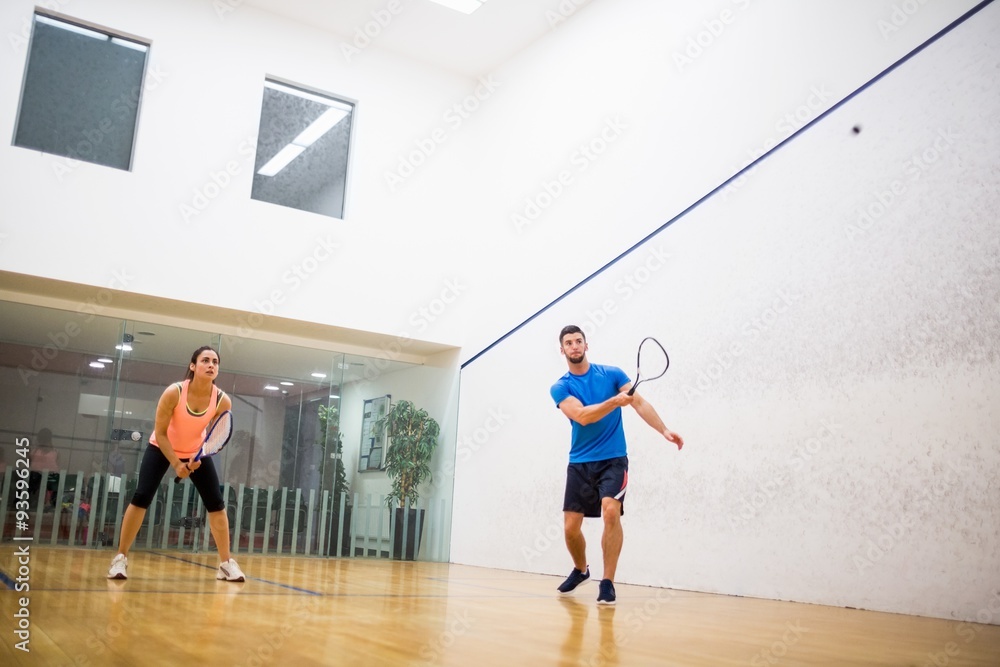 Fototapeta premium Couple playing a game of squash