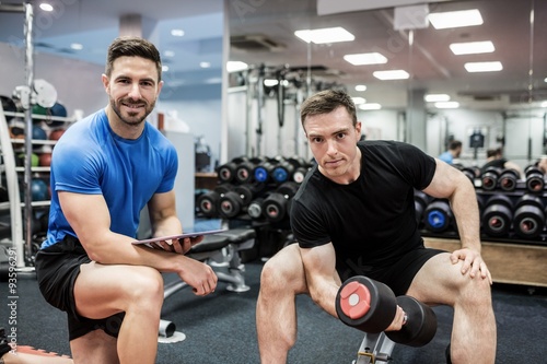 Fit man working out in weights room