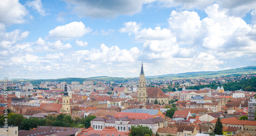 Cluj Napoca cityscape from above in the Transylvania region of Romania with the historic medieval old center, the gothic cathedral, the franciscan church and the Technical University