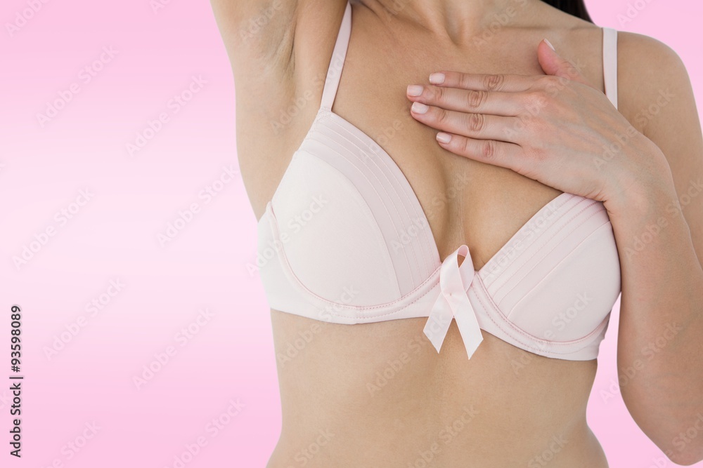 Woman in bra with pink ribbon