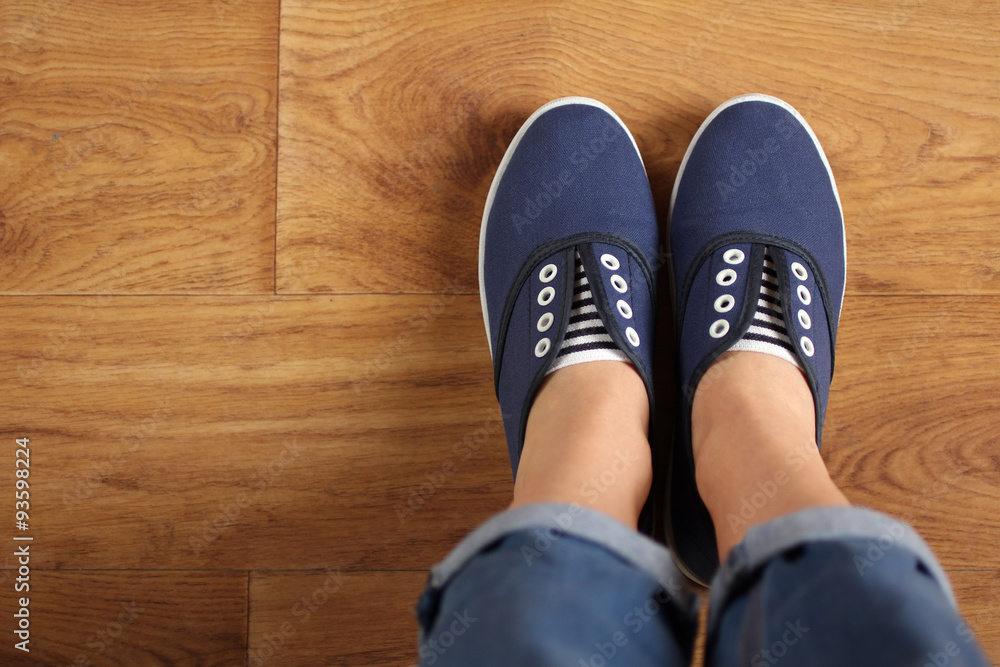 girl in shoes on wooden flooring girl in shoes on wooden flooring