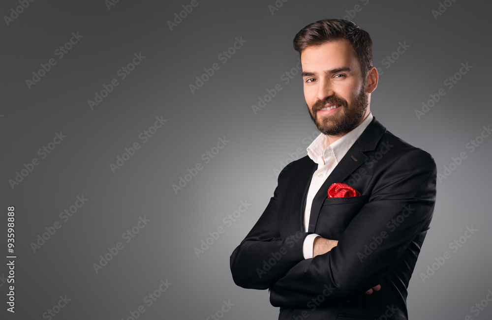 Man's style. Elegant young man in a suit posing. Studio shot. Man's style. Elegant young man in a suit posing. Studio shot.