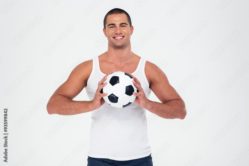 Portrait of a smiling man holding soccer ball Portrait of a smiling man holding soccer ball