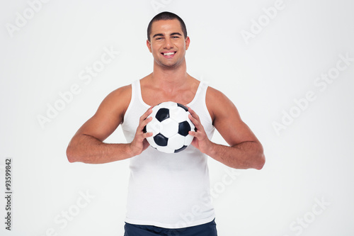 Portrait of a smiling man holding soccer ball