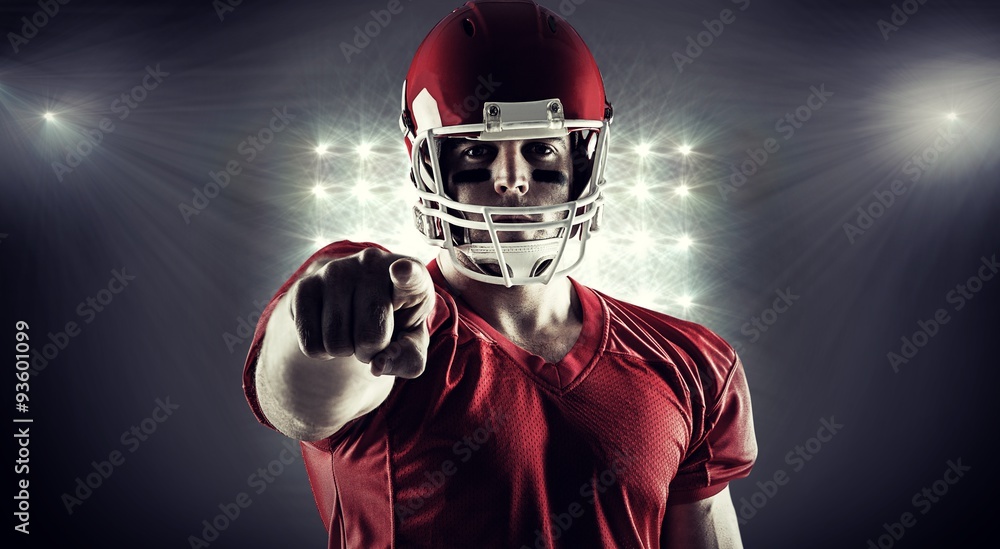 Composite image of american football player pointing at camera Composite image of american football player pointing at camera