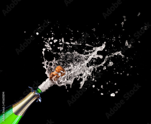 popping champagne bottle cork, splashing black background. celebration, happiness