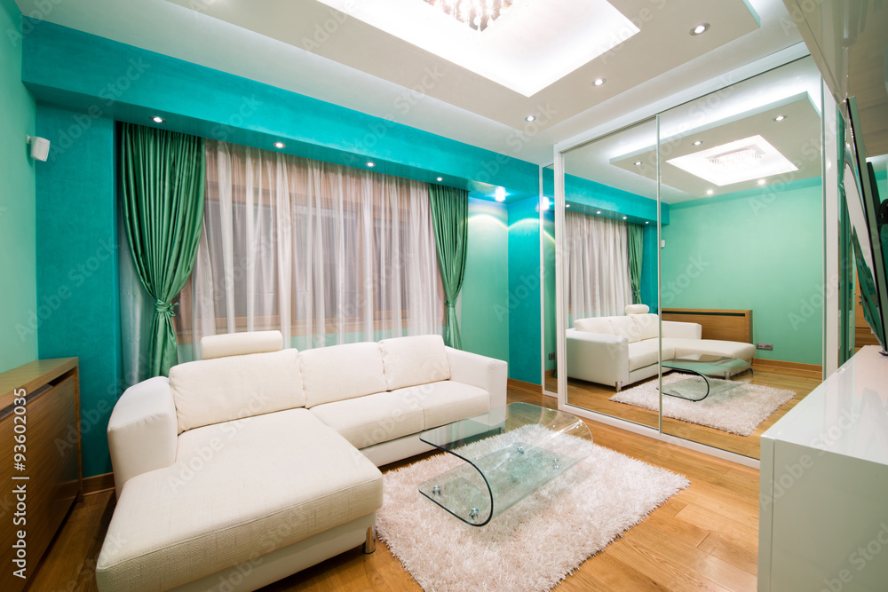 Fototapeta premium Interior of a modern green living room with luxury ceiling light