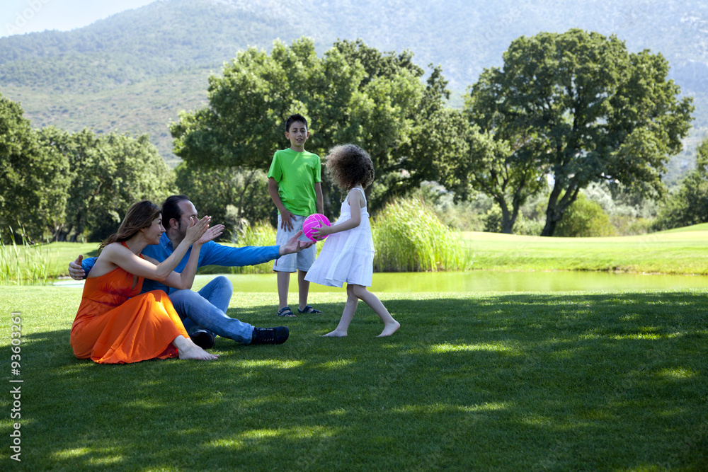 Happy family is enjoying at park on a weekend day all together Happy family is enjoying at park on a weekend day all together