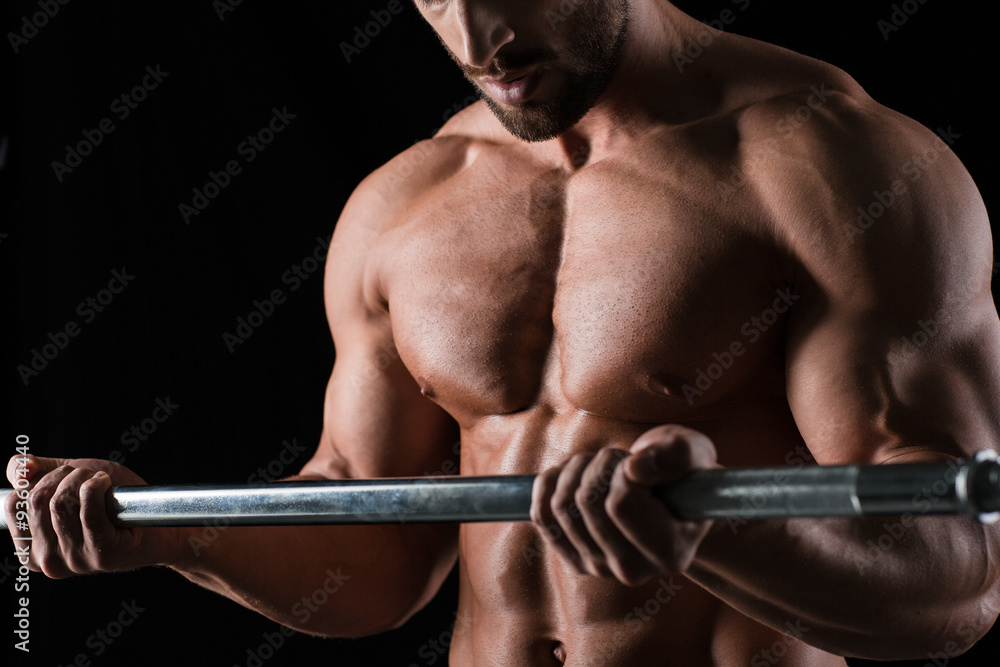 Muscular male body with barbell Muscular male body with barbell