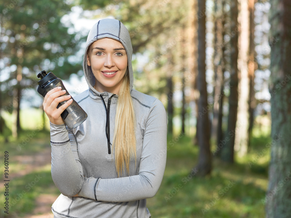 Portrait of female runner in nature after jogging Portrait of female runner in nature after jogging