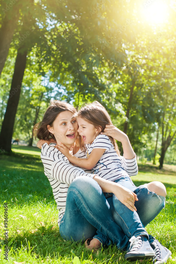 Happy Mother and Daughter have Fun on Meadow Happy Mother and Daughter have Fun on Meadow