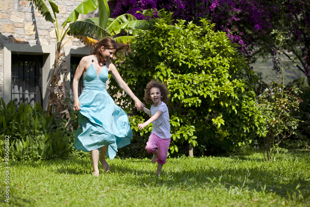 Obraz premium Mother and daughter are enjoying on grass at park