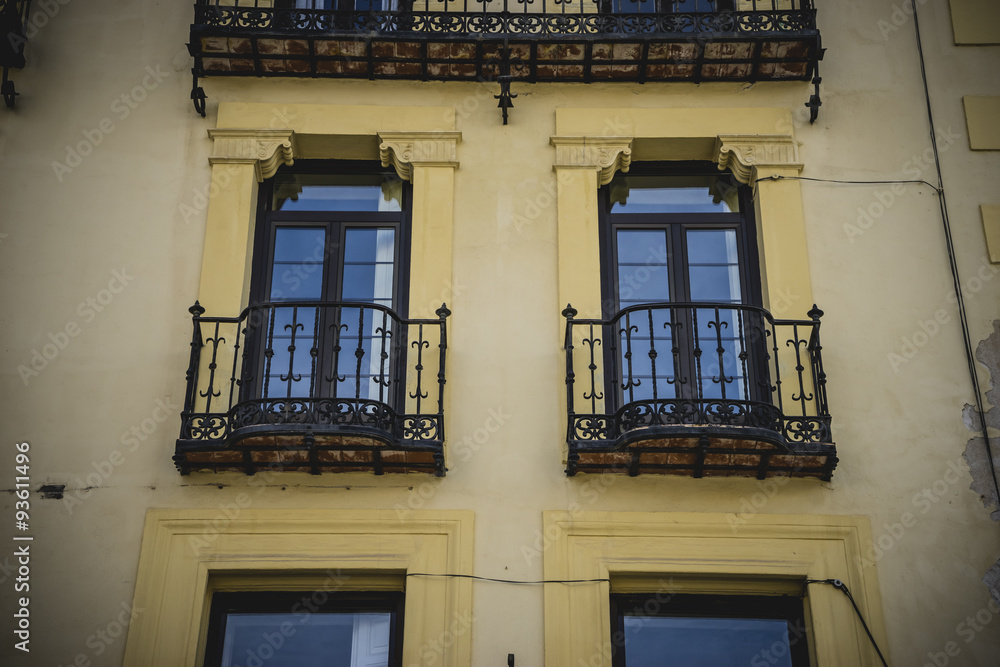 Obraz premium Traditional architecture with balconies and old windows, city of