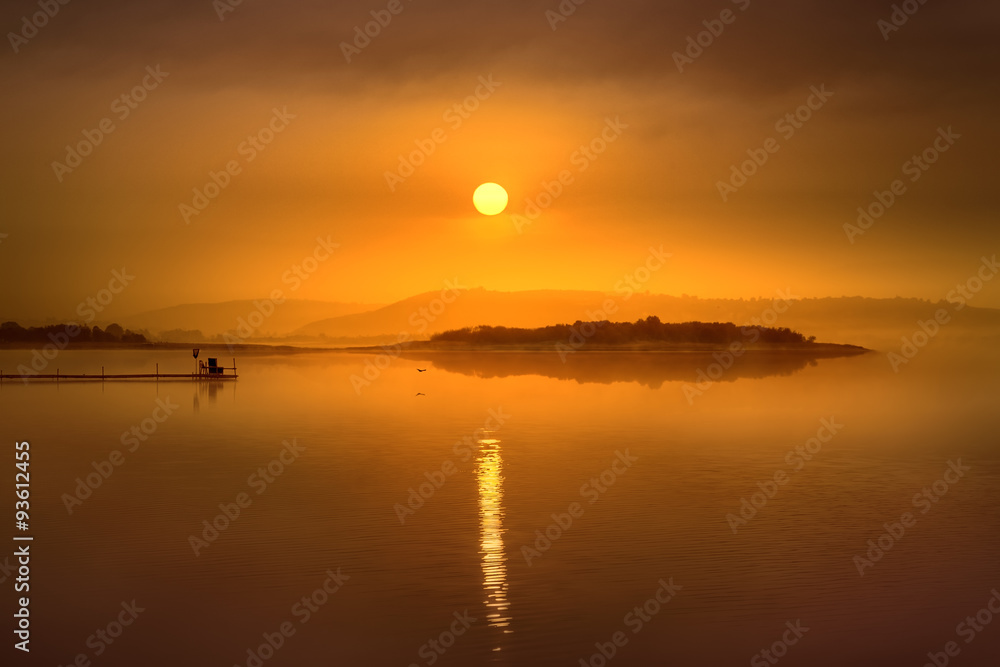 Idyllic landscape with lake towards the rising sun