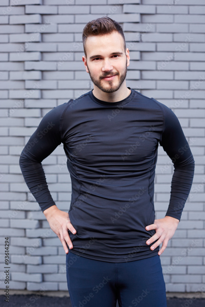 Portrait of smiling man resting after workout outdoors, fit caucasian Portrait of smiling man resting after workout outdoors, fit caucasian