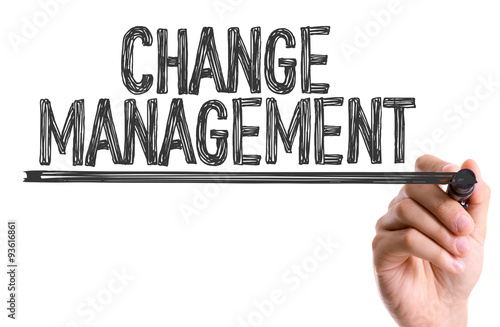 Hand with marker writing: Change Management