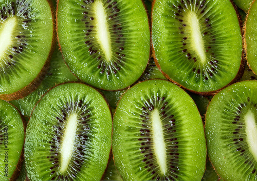 sliced kiwi green background