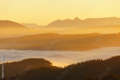 Fototapeta Naklejka Na Ścianę i Meble -  mountains with fog at sunrise