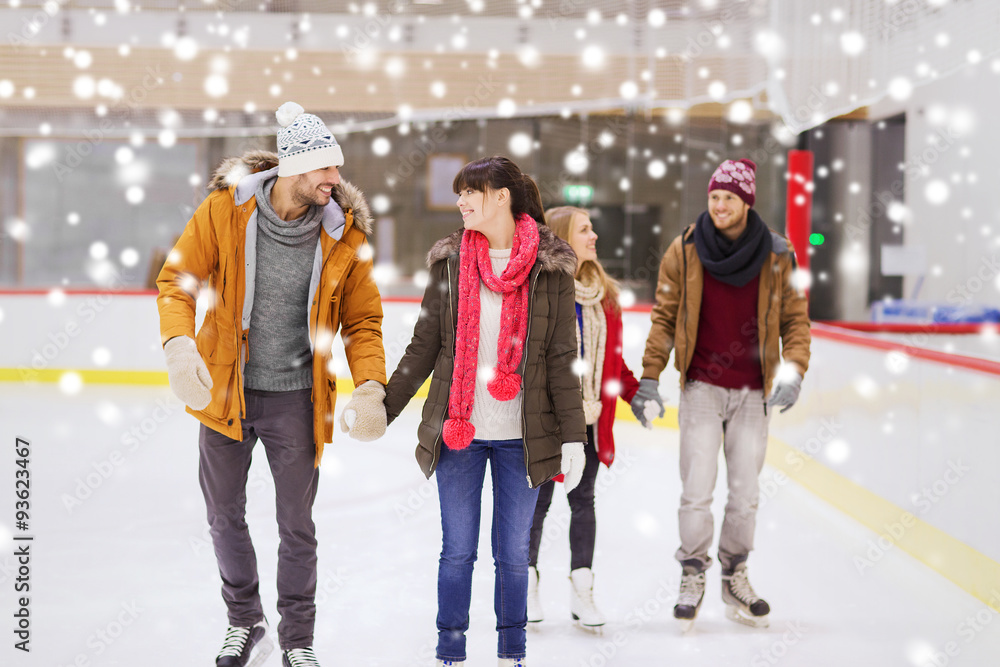 Fototapeta premium happy friends on skating rink