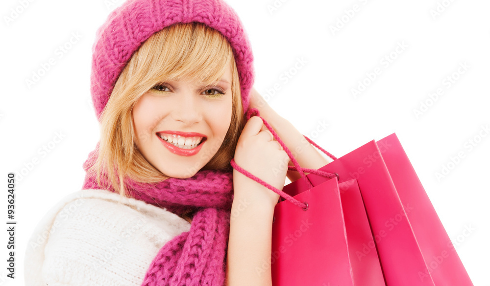 woman in pink hat and scarf with shopping bags woman in pink hat and scarf with shopping bags