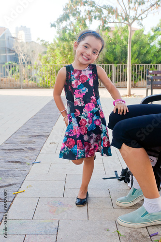 Cute little girl standing on one foot