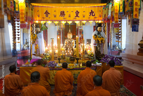 AYUTTHAYA,THAILAND-OCTOBER 17,2010 : The Chinese Monks chanting in Wat Phanan Choeng,Ayutthaya,Thailand. photo