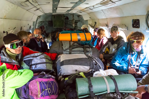 Passengers Inside Cargo Helicopter with Many Backpacks
