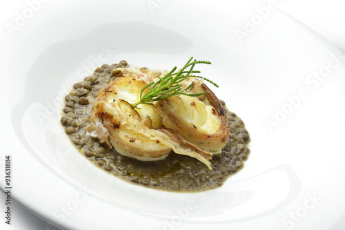 Monkfish with crispy bacon on lentils