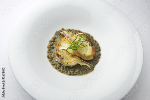 Monkfish with crispy bacon on lentils