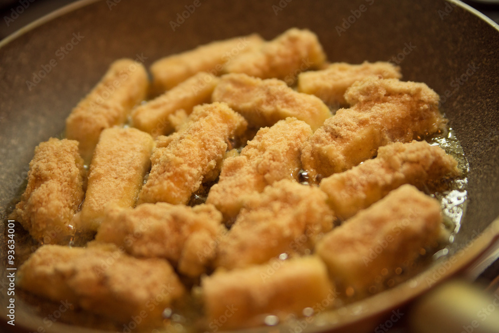 breaded cheese on a pan breaded cheese on a pan