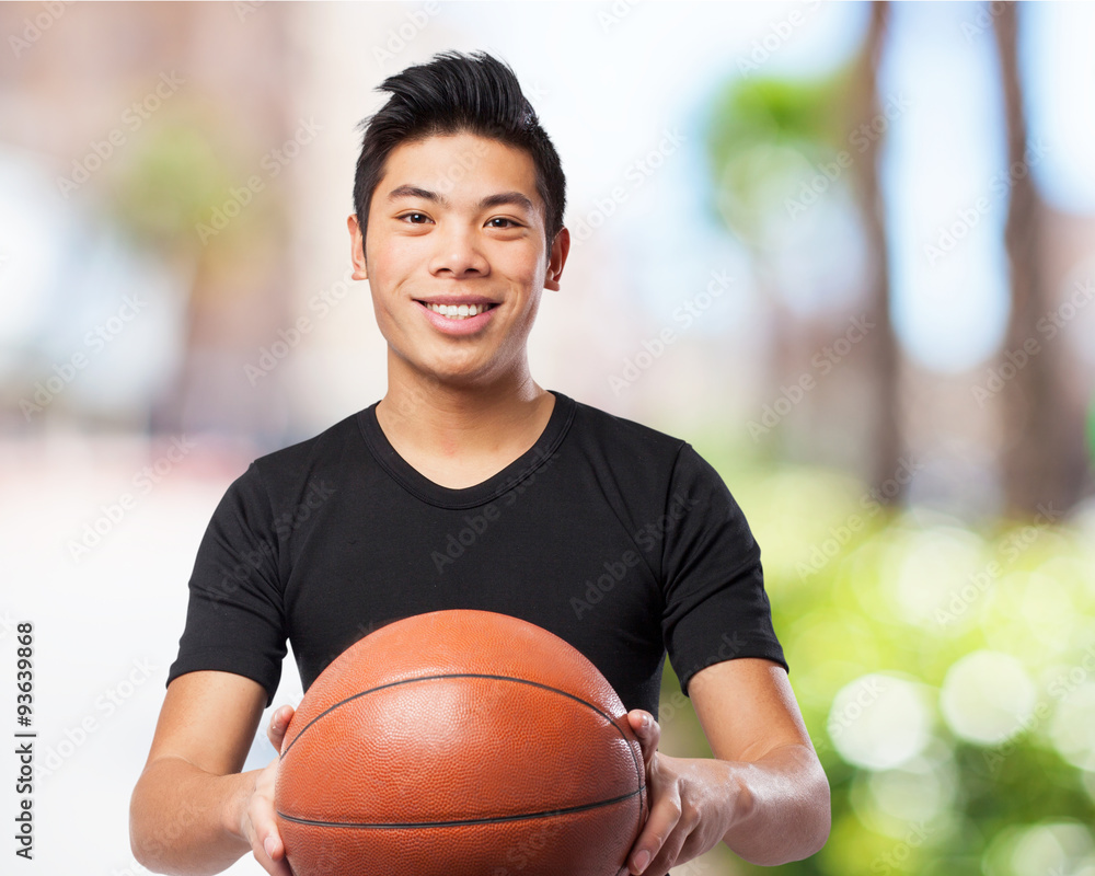 happy chinese sport man with basket ball happy chinese sport man with basket ball