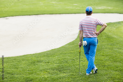 Young man playing golf