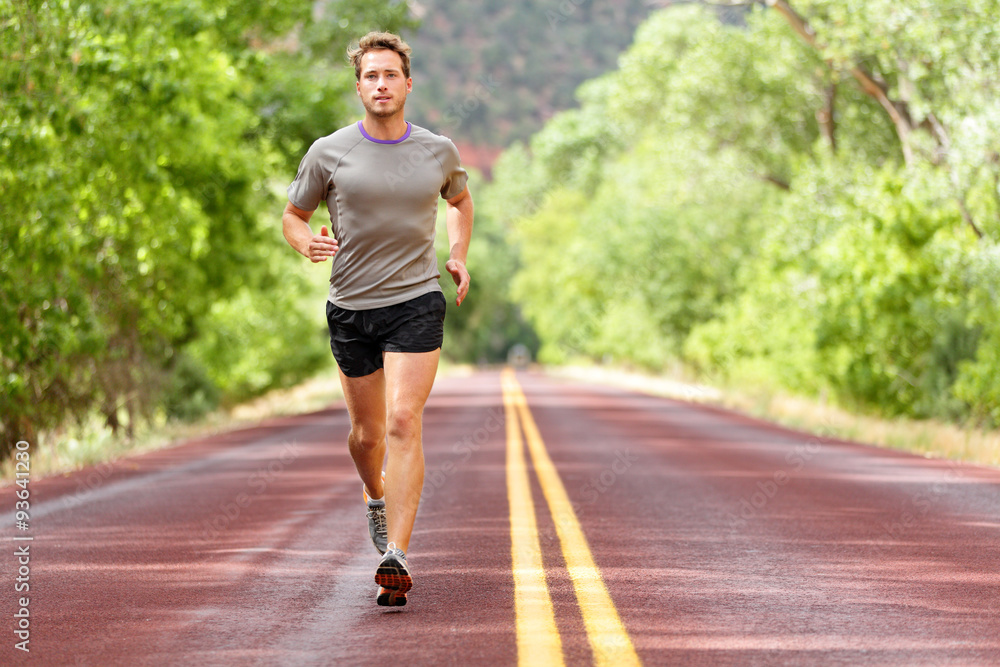 Sport and fitness runner man running on road Sport and fitness runner man running on road