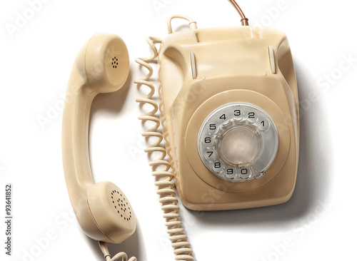 Retro yellow phone isolated on white background
