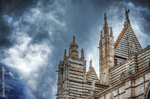 Siena Duomo under a dramatic sky seen from behind © Gabriele Maltinti
