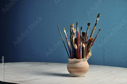Brushes in a clay jug