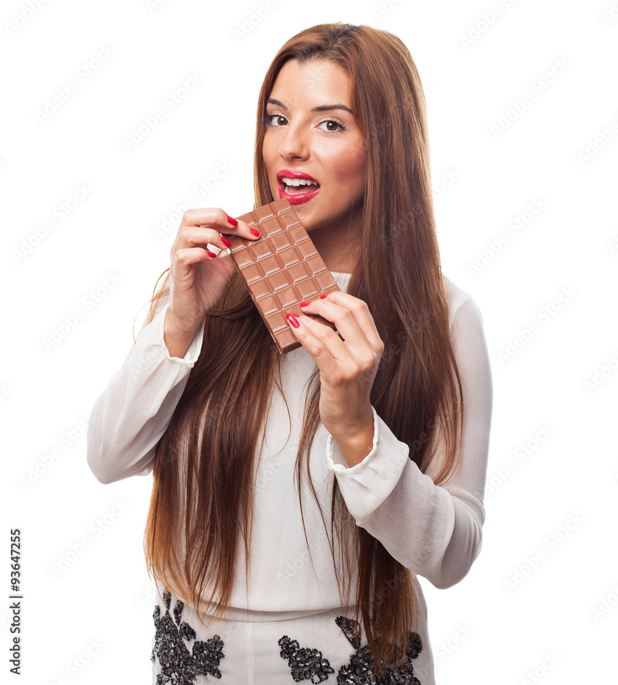 portrait of a pretty girl biting a chocolate bar portrait of a pretty girl biting a chocolate bar