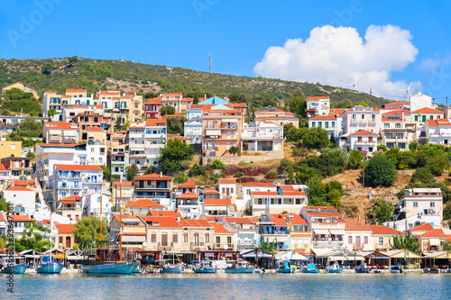 View of Pythagorion port with colourful houses built on hill, Samos island, Greece © pkazmierczak