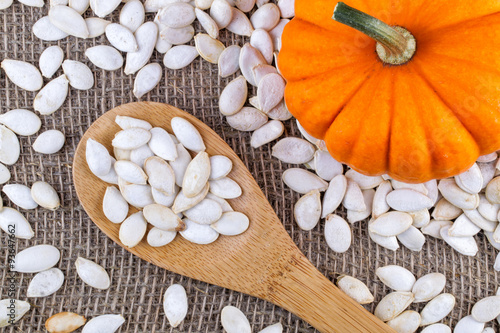Closeup on small pumpkin and seeds
