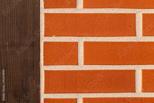 Background of  brick wall with wooden post