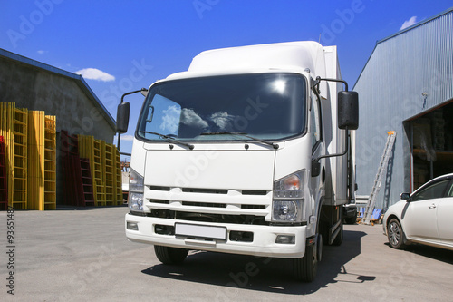 white truck at warehouse buildings