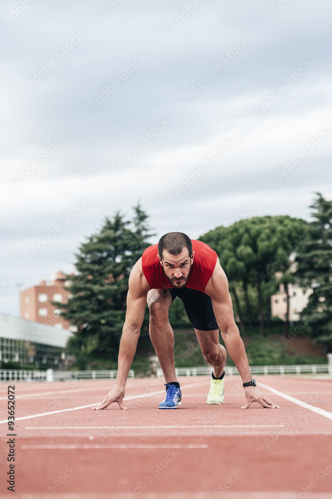 Man getting ready to start running Man getting ready to start running