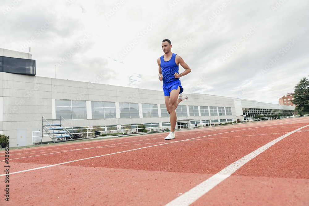 Obraz premium Attractive man Track Athlete Running On Track