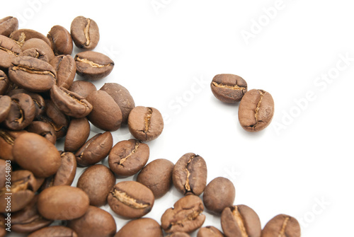 heap of coffee beans on white